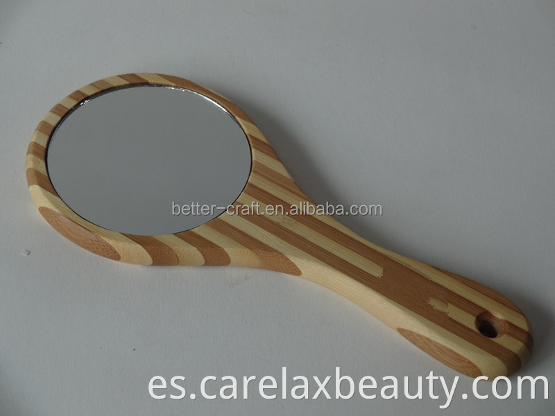 Espejo de bambú de mano caliente en un marco redondo de madera